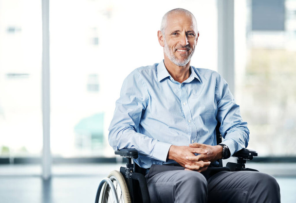 Theres no excuse not to live with a purpose. Portrait of a mature man sitting in a wheelchair - Foto, Bild