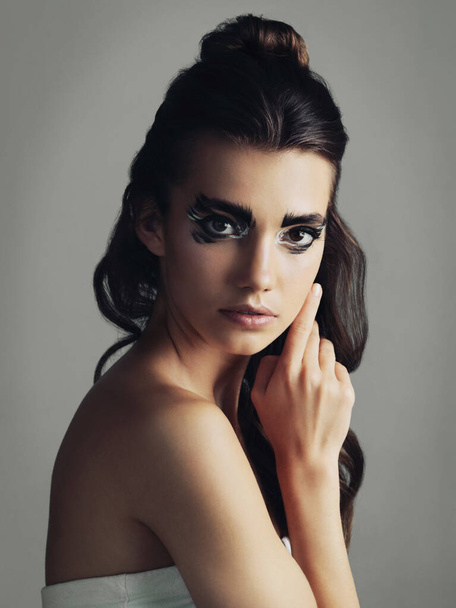 Dont let today be a waste of makeup. Studio shot of an attractive young woman wearing bold eye makeup - Foto, immagini