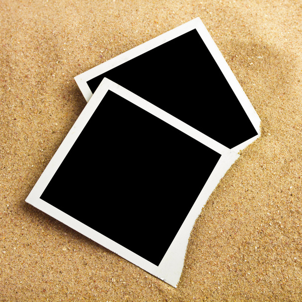 Photo frame on sand background - Foto, imagen