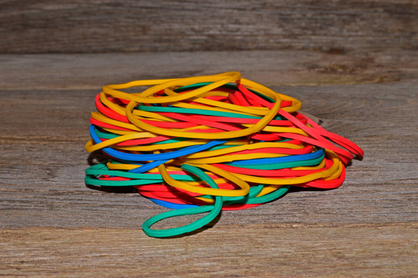 rubber band isolated on wooden background - close-up - Photo, Image