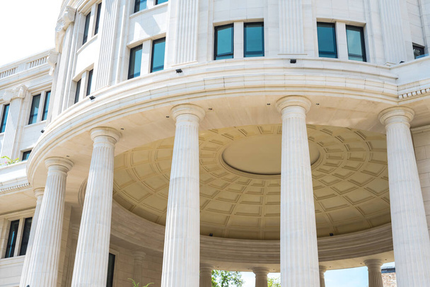 Close-up view outside of government building in Hanoi, Vietnam. White pillars columns and a dome. - 写真・画像