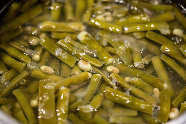 Green bean boiled in water in a pot. Selective Focus - Fotografie, Obrázek