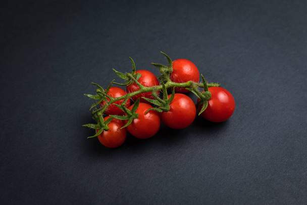 Cherry tomatoes on branches, top view - Фото, изображение
