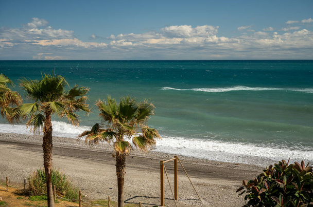 View on beach and coastline in Torrox Costa, Costa del Sol, small touristic town between Malaga and Nerja, Andalusia, Spain. Overwinter in Spain. - Foto, immagini