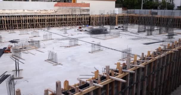 Precast concrete slabs and metal bars outdoors at construction site. Construction building concept - Imágenes, Vídeo