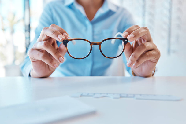 Glasses, eye care and eyewear or optometry eyeglasses for woman with disorders and myopia. Closeup hands of customer buying, purchasing and testing stylish prescription spectacles in clinic and shop. - 写真・画像