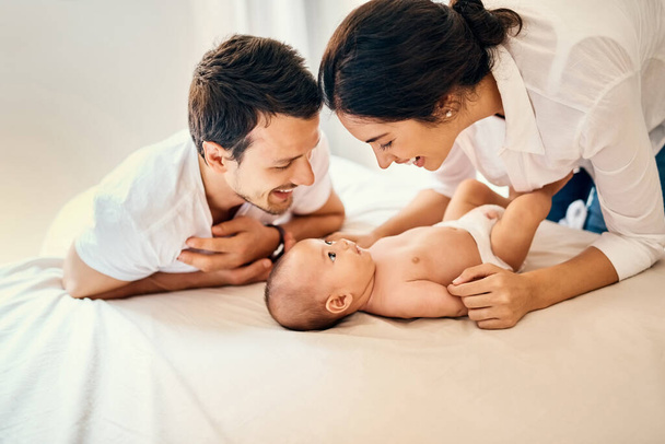 Family, a little bit of heaven on earth. a happy mother and father bonding with their baby boy at home - 写真・画像