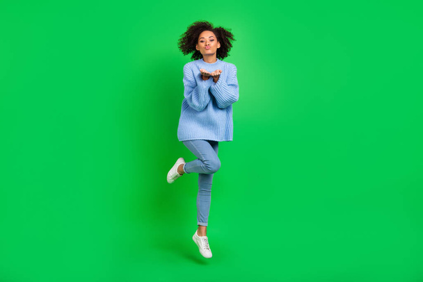 Full body portrait of lovely cute person jump arms palms send air kiss you isolated on green color background. - Fotografie, Obrázek