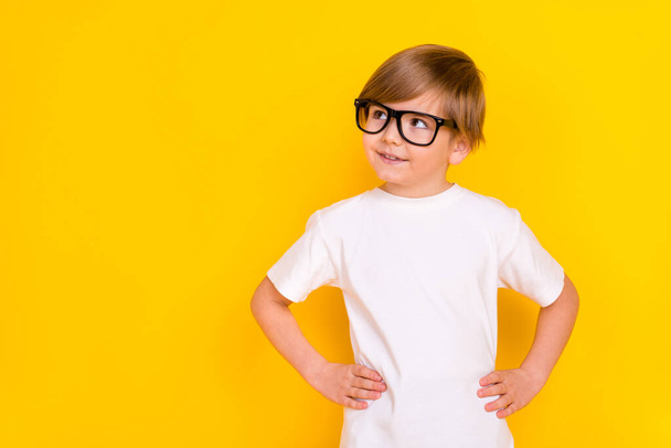 Portrait of handsome brainy cheerful pre-teen boy learner think copy blank space isolated over bright yellow color background. - Fotoğraf, Görsel