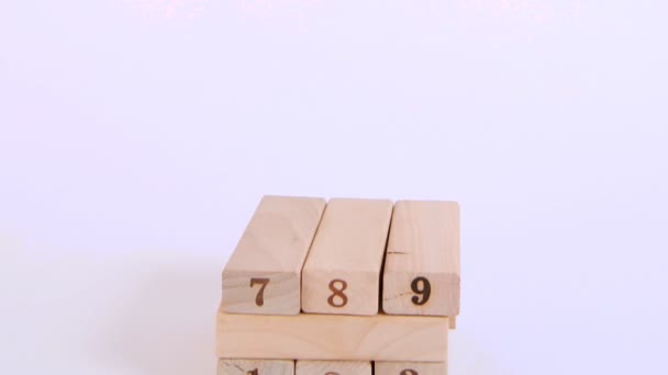 Wooden cubes are built in high tower - Video, Çekim