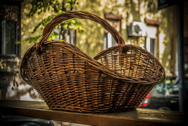 A Big Wicker Basket on a table outdoors - Photo, Image