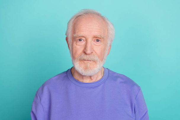 Photo of calm aged grandparent look camera isolated on vibrant aquamarine color background. - Fotó, kép