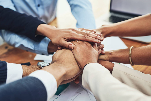 Trust, support and unity by a team of hands starting a business together. Community, partners and teamwork with a group of excited, diverse professionals with an idea, vision or goal for a startup. - Foto, Imagen