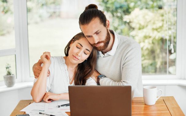 Support, couple and finances while embracing each other and sitting with papers and a laptop for bill payments and looking worried in a tough economy. Husband and wife having financial difficulties. - Foto, Bild
