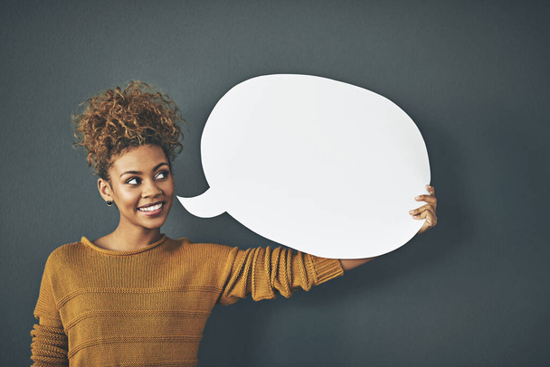 Woman holding speech bubble, chat board and blank copy space poster for voicing opinions, talking on social media or sharing ideas. Creative speaking about marketing strategy, innovation or vision. - Fotografie, Obrázek