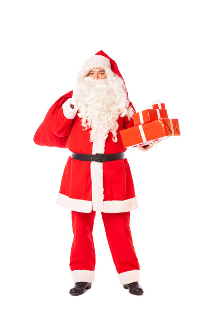 Joulupukki pitää hänen säkki lahjoja valkoisella taustalla
 - Valokuva, kuva