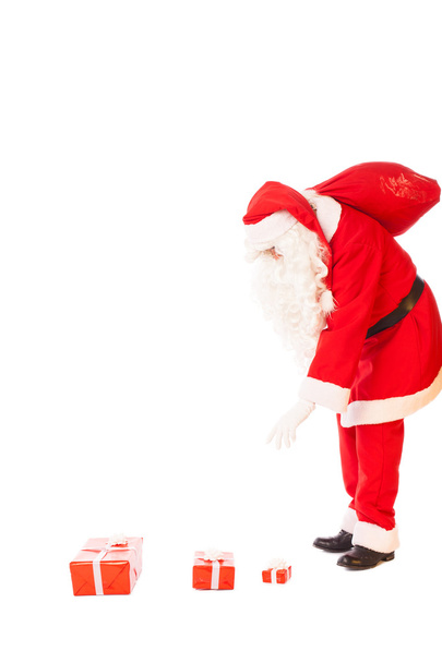 Дід Мороз тримає його мішок подарунків на білому тлі - Фото, зображення