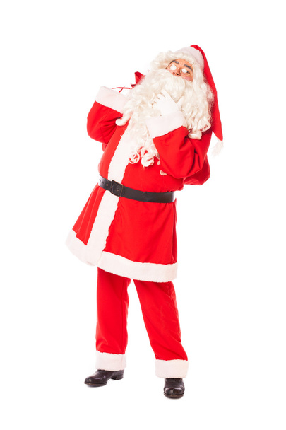 Санта Клаус держит мешок с подарками на белом фоне
 - Фото, изображение