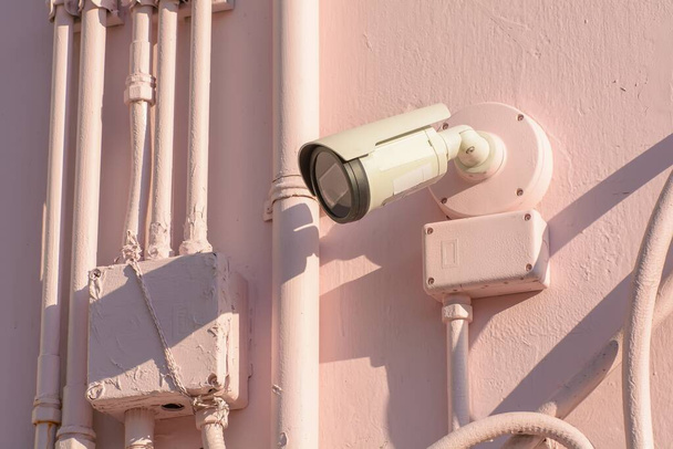 The CCTV security camera on a stone wall - Fotoğraf, Görsel