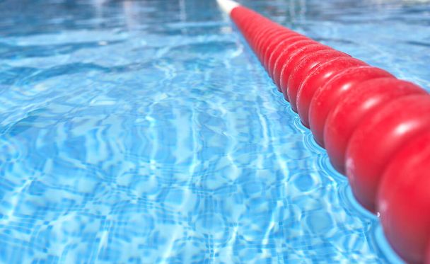 detail of a beacon or buoy separating a lane in a swimming pool - Foto, Bild