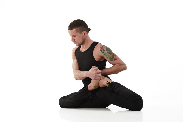 Yoga Man posing in studio - Фото, изображение
