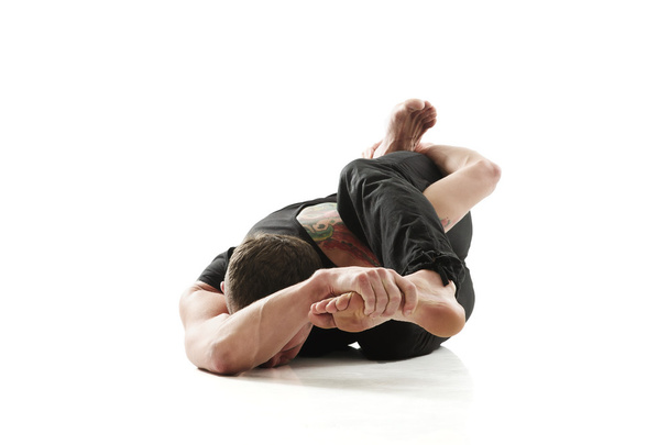Yoga Man posing in studio - Foto, immagini
