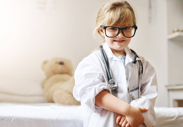 One day Ill save lives just like mommy does. Portrait of an adorable little girl dressed up as a doctor - Photo, Image