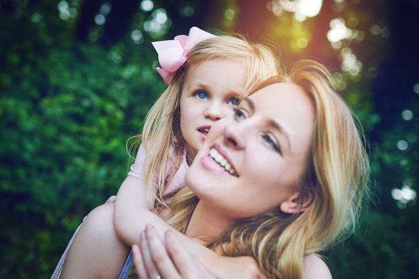 Mummy time is the best time. an adorable little girl bonding with her mother during a day outdoors - Zdjęcie, obraz