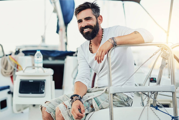 Enjoying every aspect of his surroundings. a handsome mature man on his yacht - Photo, Image