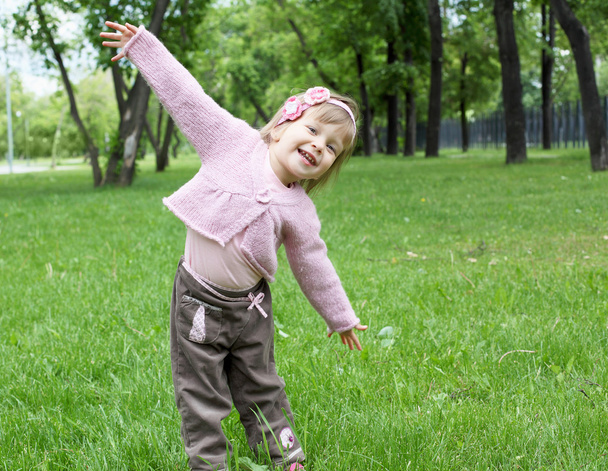 Portrait of a little girl outdoors - Fotó, kép