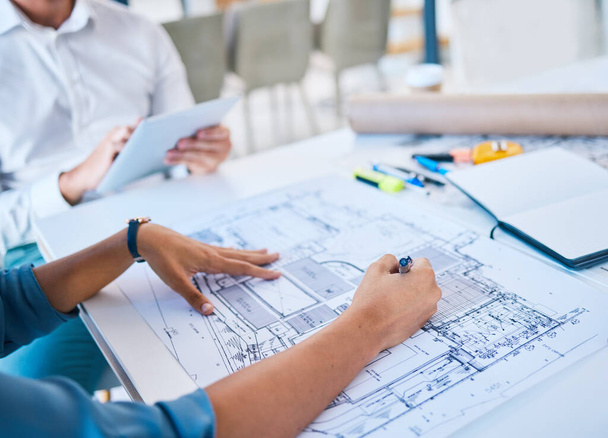 Architect sketching, designing blueprint or doing architecture, engineering or structure drawing on paper at a work studio with hands closeup. Business person working on a design project development. - Foto, Imagem