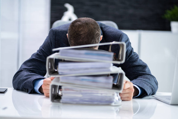 Tired Sad Man Overworked In Office. Accounting Stress - Zdjęcie, obraz