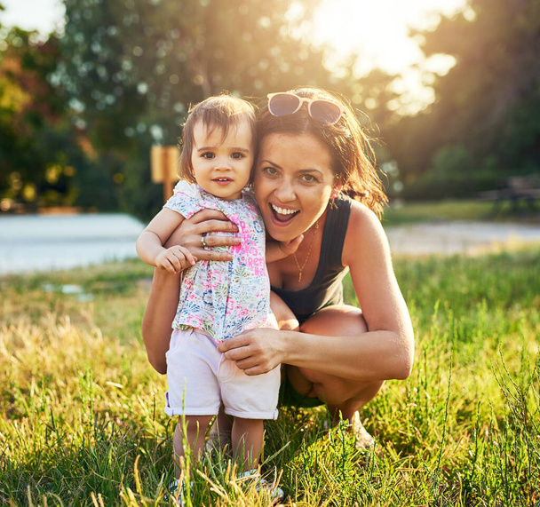 My tiny bundle of joy. a young mother and her little girl outdoors - Photo, image
