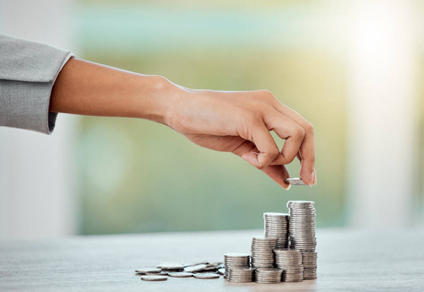Saving, money and growth for small business finance, coin stack of money for growing economy. Financial wealth and investment for profits, accounting or economics in the workplace over copy space. - 写真・画像