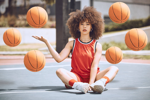 Female basketball player sitting with balls in the air on a court, learning fitness training and doing sport exercise and workout outside. Portrait of a black woman playing game and looking confident. - Foto, Imagem