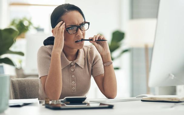 Confused, stress and frustrated worried financial planner, accountant upset and worried budget at work with a computer, notebook and plan form. Anxious female with finance, money problems and issue. - Φωτογραφία, εικόνα