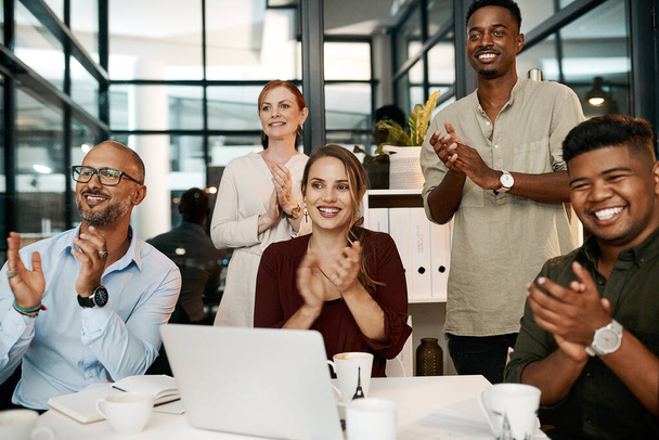 Clapping and cheering business people happy at a design conference. Diverse creative group of designers excited by a goal or idea during a presentation or speech, showing support and unity. - 写真・画像