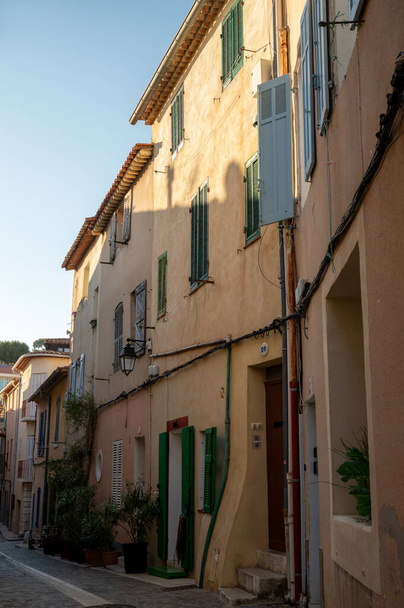 Sunny day in South of France, walking in ancient Provencal coastal town Cassis, narrow streets and colorful buildings, Provence, France in spring - Fotó, kép