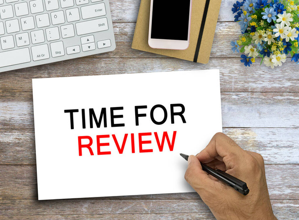 Online Reviews Evaluation time for review Inspection Assessment Auditing text on wood table background. Business concept. Flat lay with blank copy space top view. - Foto, immagini