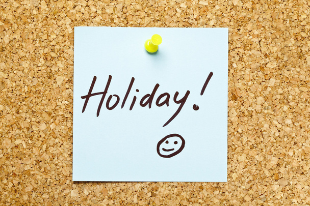 Blue sticky note 'Holiday!' - Zdjęcie, obraz