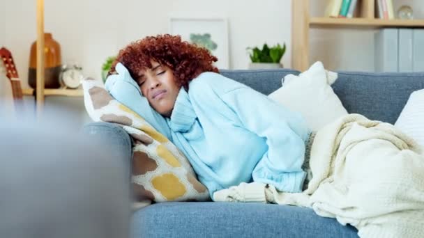 Stomach pain, period or menstruation cramp or sick, ill and unhappy woman with diarrhea lying on sofa at home. Sad unwell girl suffering from endometriosis in abdomen, PMS symptoms or bad healthcare. - Felvétel, videó