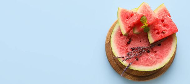 Cut sweet watermelon on light blue background with space for text - Foto, immagini