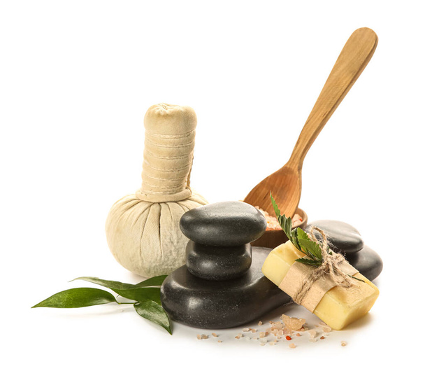 Spa composition with stones and massage bag on white background - Photo, Image