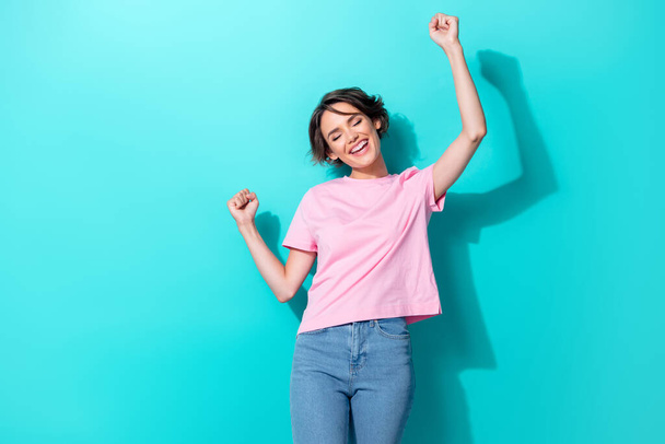 Photo of cool short hairdo young lady yell wear pink t-shirt jeans isolated on turquoise color background. - Foto, Imagem
