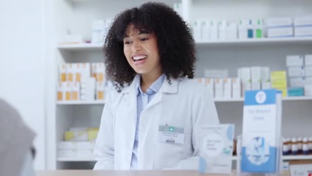 Friendly pharmacist helping patient with prescription medication, pills or medicine at a pharmacy, clinic or drug store. Female pharmaceutical with customer service, giving medical advice. - Video