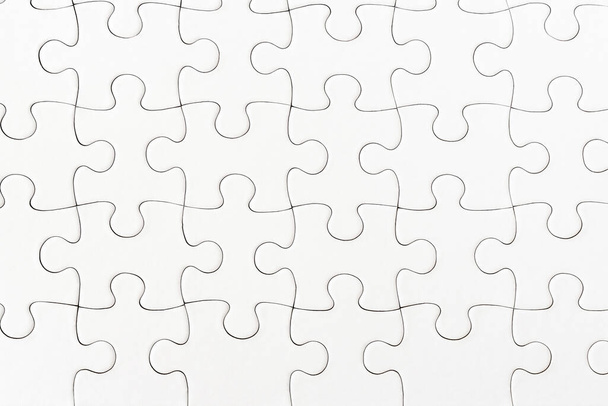 close-up view of plain white jigsaw puzzle background - Foto, Bild