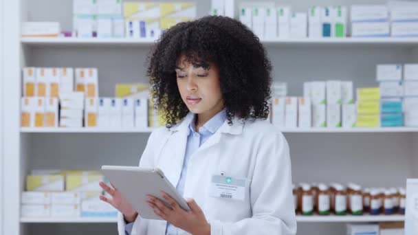 Pharmacist, doctor and healthcare worker with tablet working with online digital prescription for patient or customer. Afro medical female student in pharmacy or hospital with medicine for health - Filmati, video
