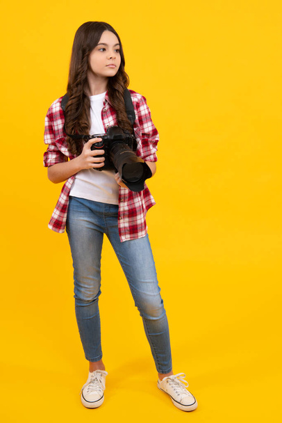 Teen girl with photo camera, young talented photographer. Photo journalism school. Shooting with professional camera. Photographing hobby - Fotoğraf, Görsel