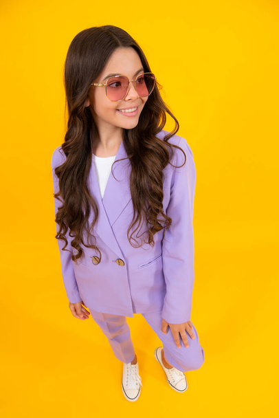 Elegant fashion teenager child girl posing in studio. Trends kids clothes - Φωτογραφία, εικόνα