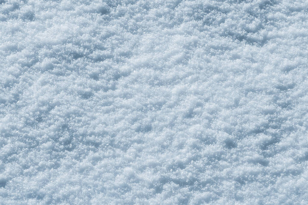 Texture of snow in sunny weather. Snow cover with snow crystals - Zdjęcie, obraz